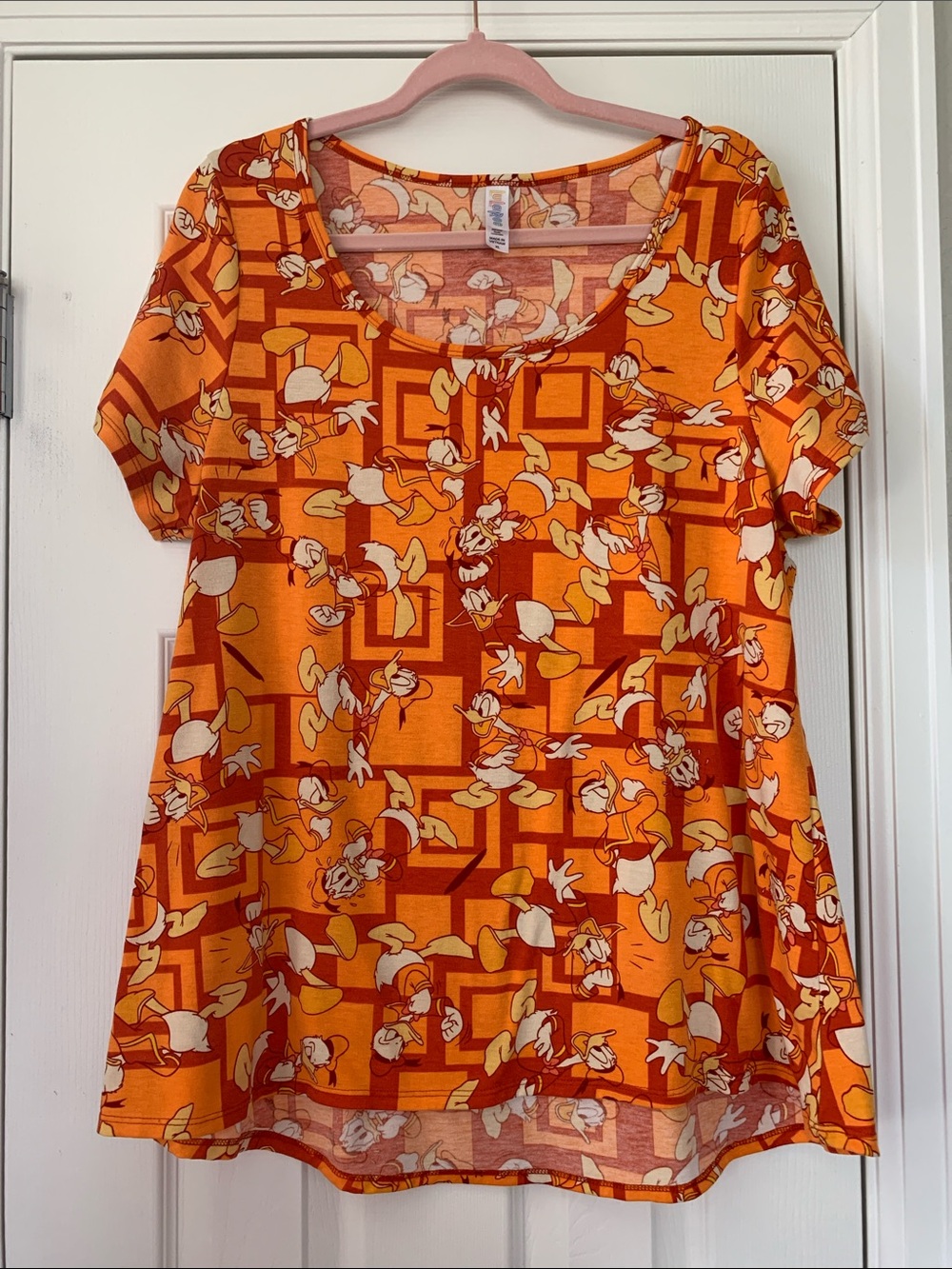 LuLaRoe Donald Duck Geometric & Floral Short Sleeve Scoop Neck Top